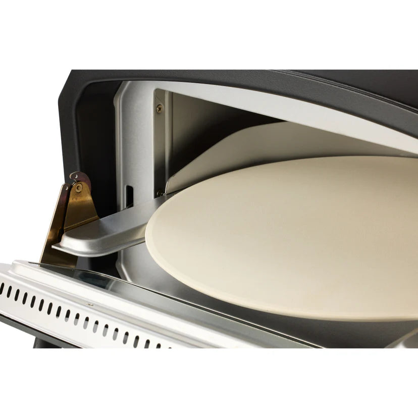 Pizza being cooked in a pizza oven with a white background