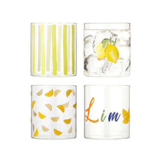 Set of four glass tumblers with lemon-themed designs on a white background