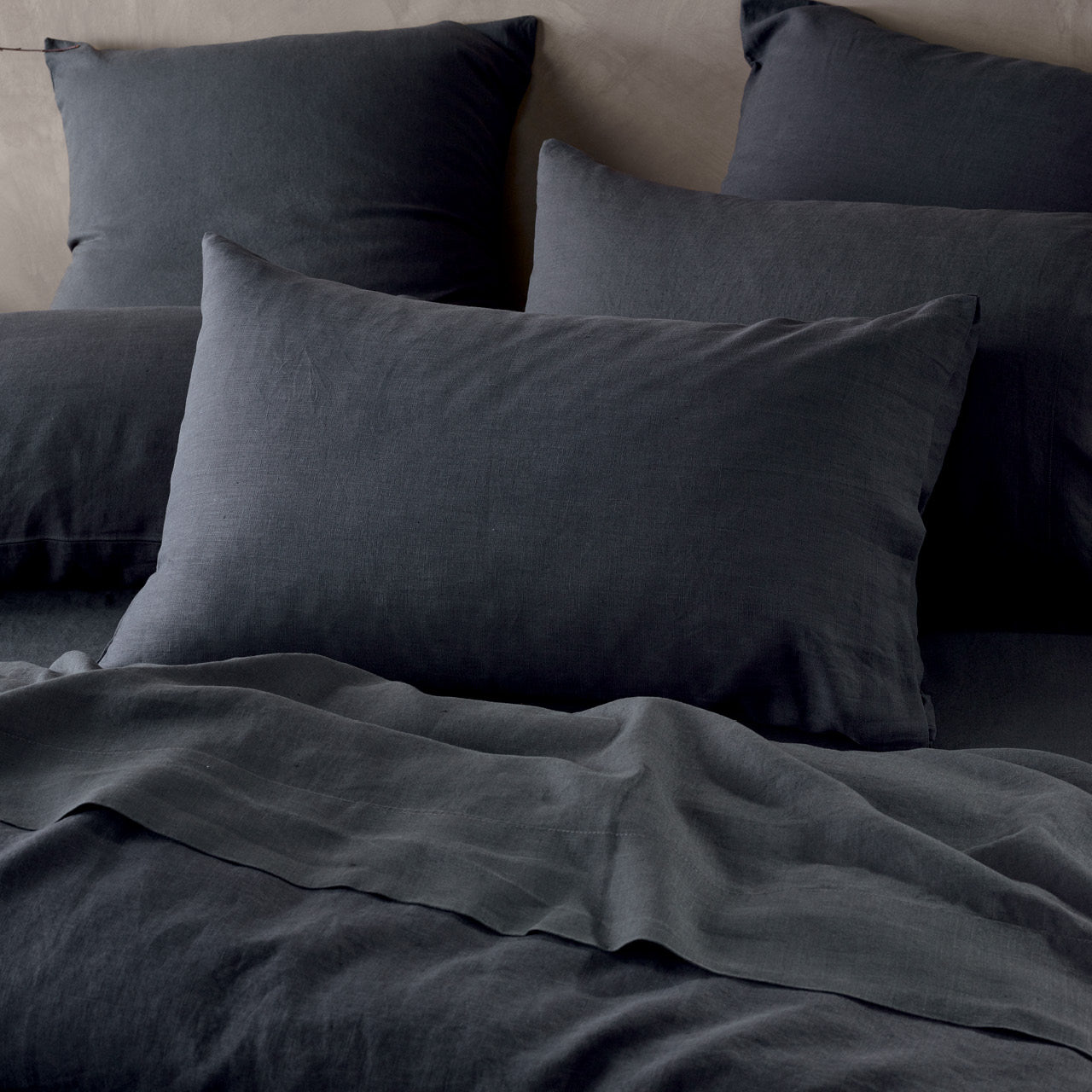 Close up shot of Elayna Charcoal Pillowcases on bed