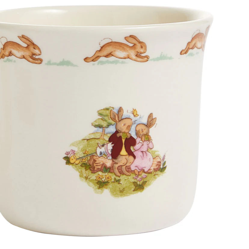 Ceramic cup with rabbit illustrations on a white background