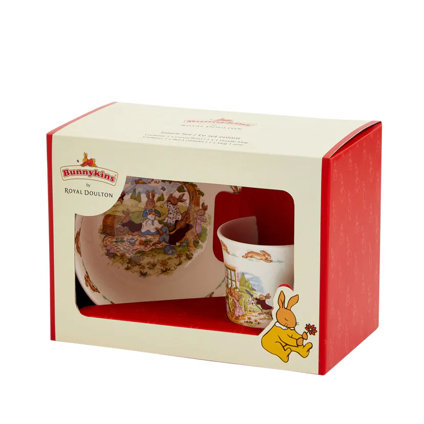 Bunnykins by Royal Doulton cup and saucer set in a decorative box on a white background