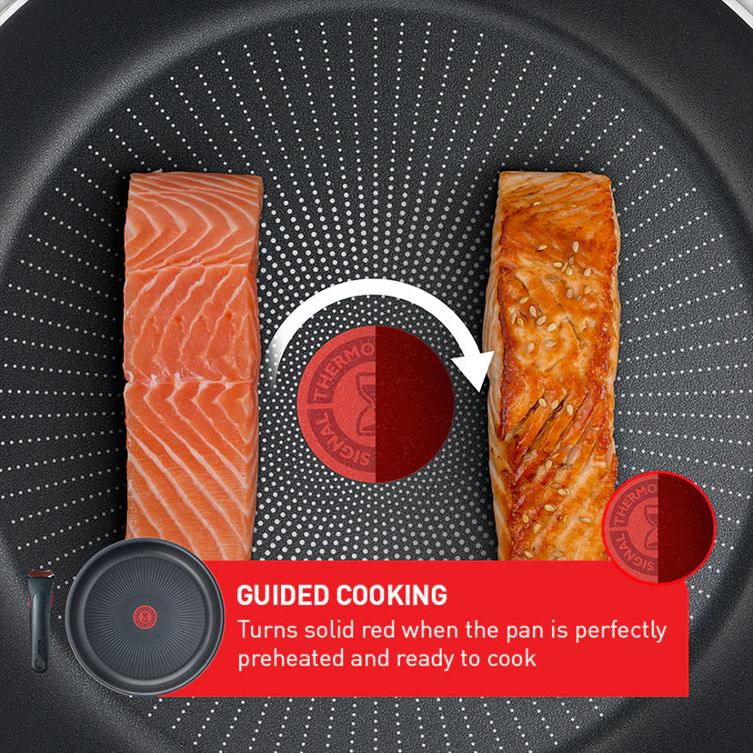 Cooked salmon fillet on a heated pan with a brand logo and text about guided cooking.