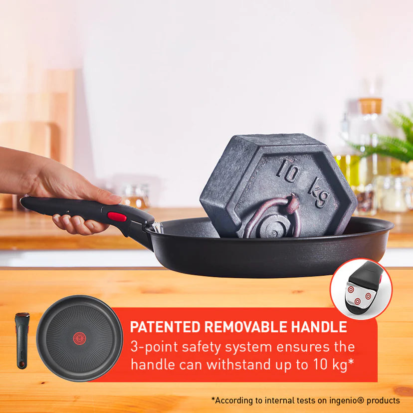 Person holding a frying pan with a hexagonal weight labeled '10 kg' on a kitchen counter.