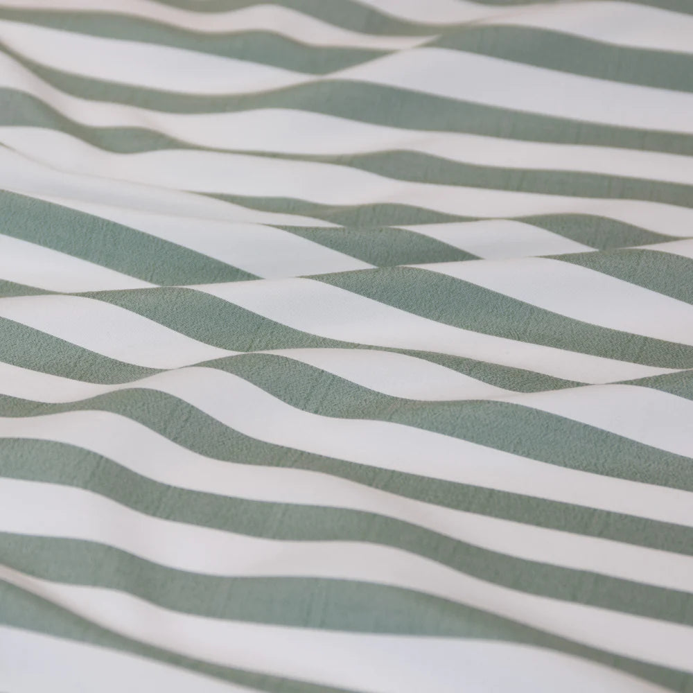 Fabric with green and white wavy stripes
