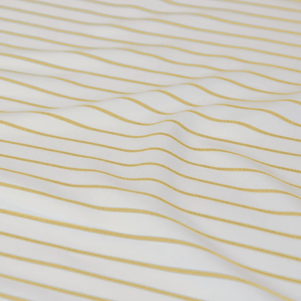 Textured fabric with wavy yellow lines on a white background