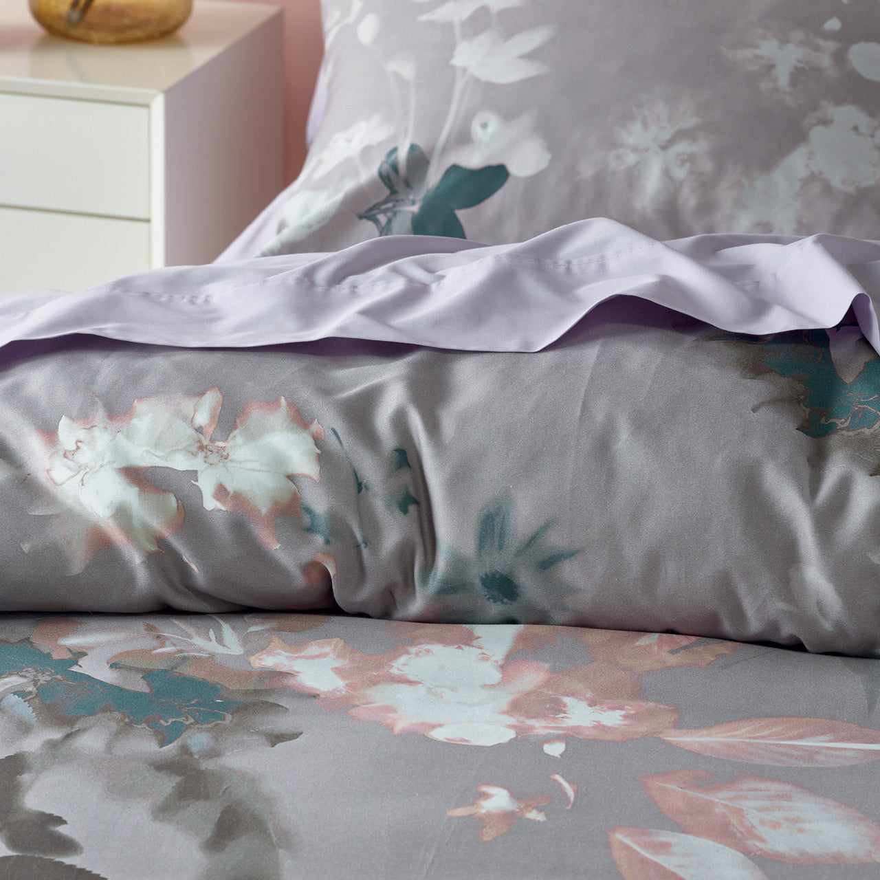 Close up shot of Aleria Quilt Cover on bed