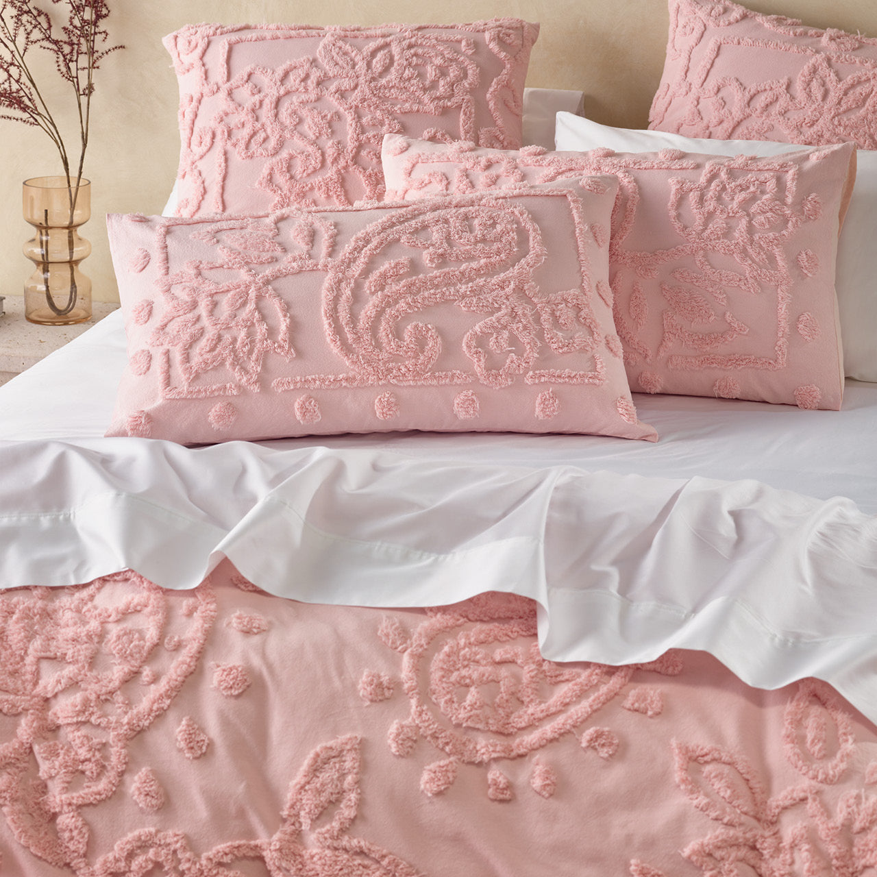 Close up shot of Alice Rose pillowcases on bed