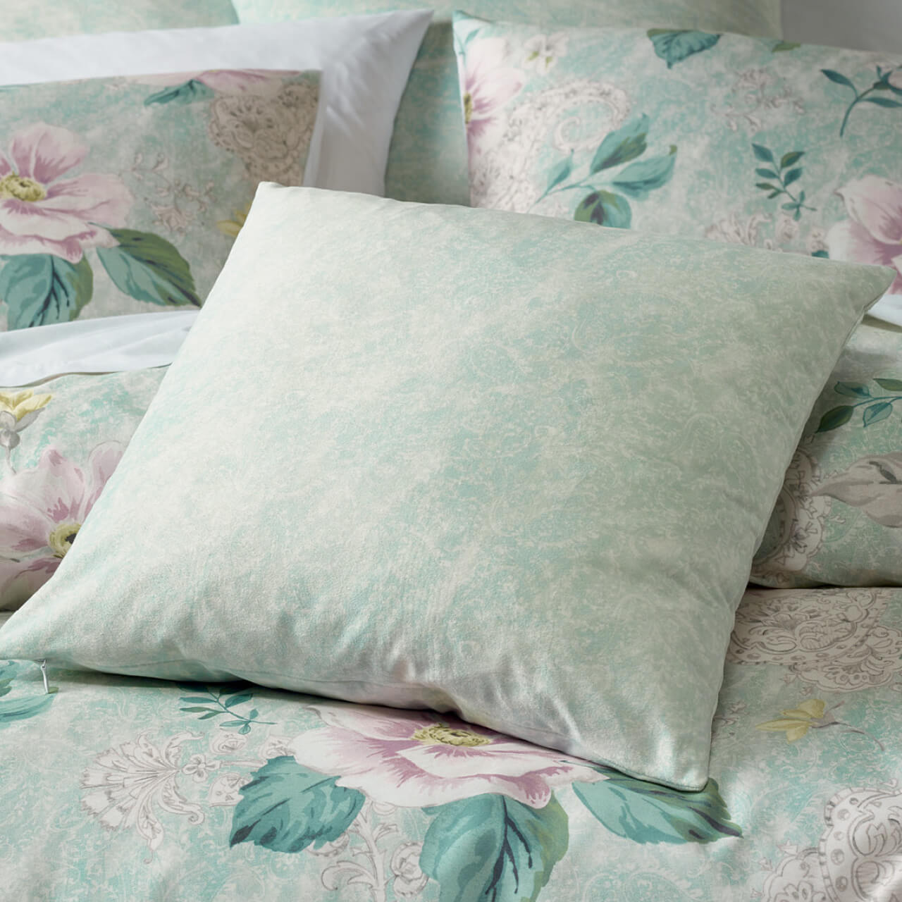 Zoomed in shot of Alyssa Cushion Cover on bed