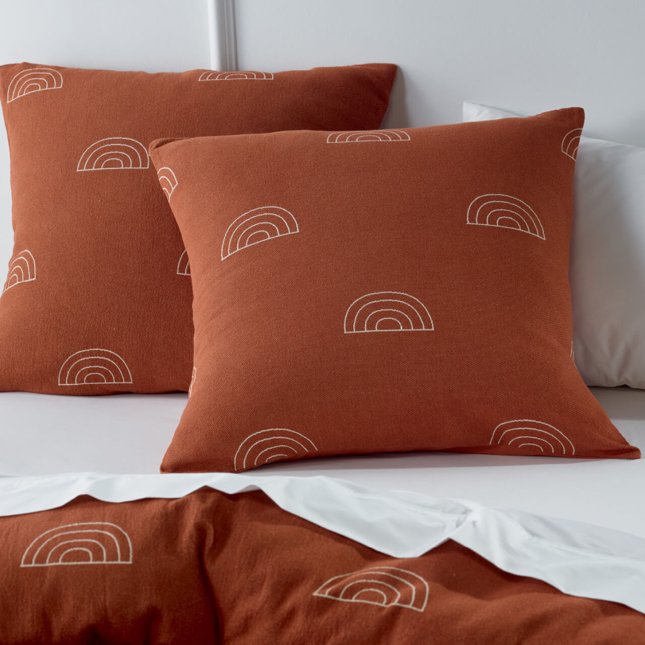 Zoomed in shot of Arco European Pillowcases on bed