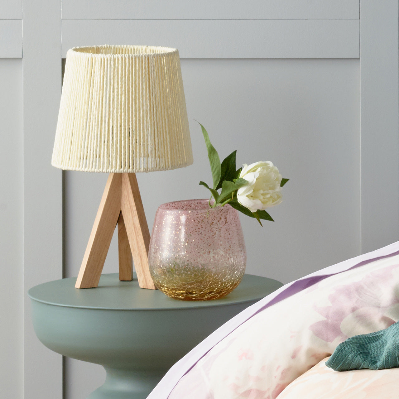 Arwen Lamp on table next to bed with Loures Vase with flowers