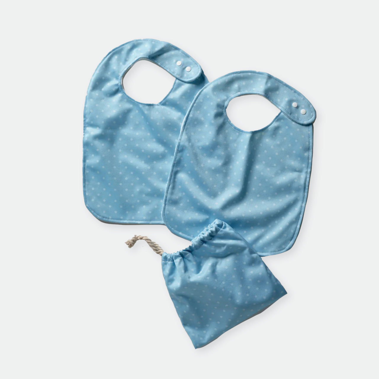 Baby Basics Blue Spots Bibs and bag on a white background