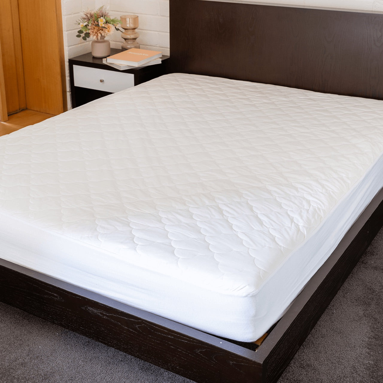 Lifestyle image of Bamboo Wool Mattress Protector on bed 
