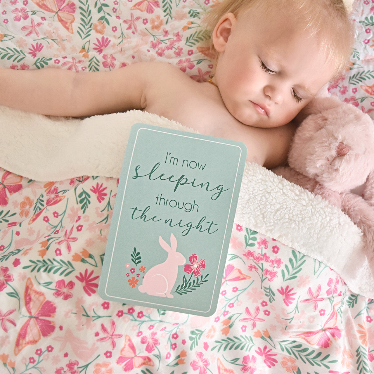 Lifestyle shot of Botanical Milestone Card on sleeping baby