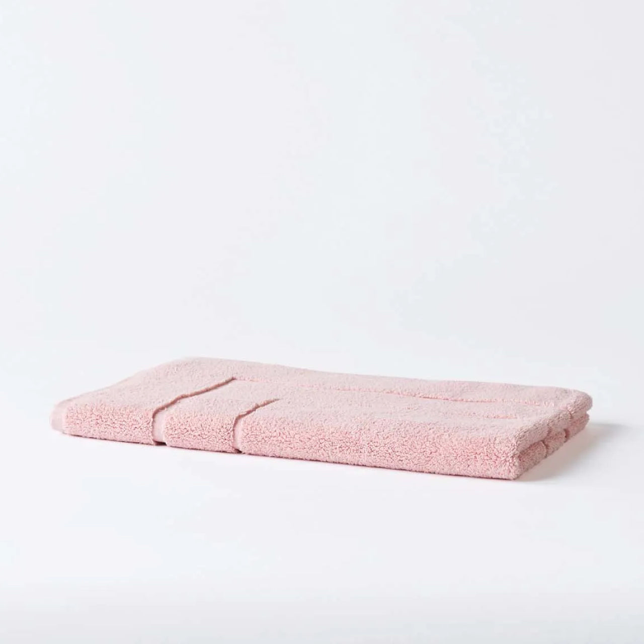 Cooper Bath Mat Blush on a white background