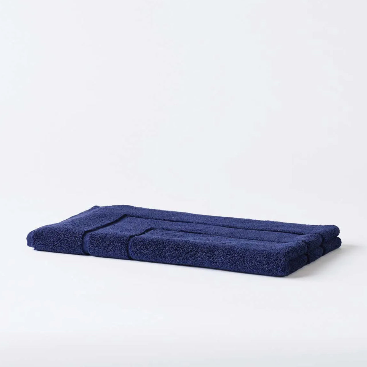 Cooper Bath Mat Indigo on a white background