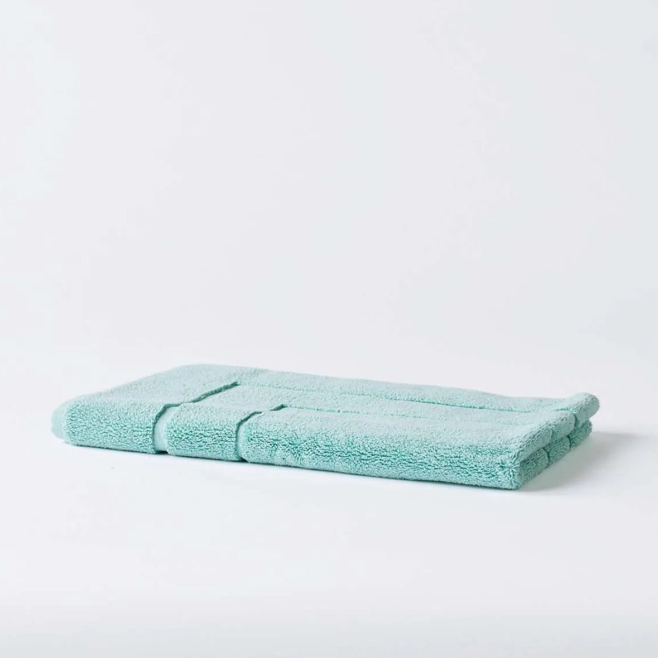 Cooper Bath Mat Mint on a white background