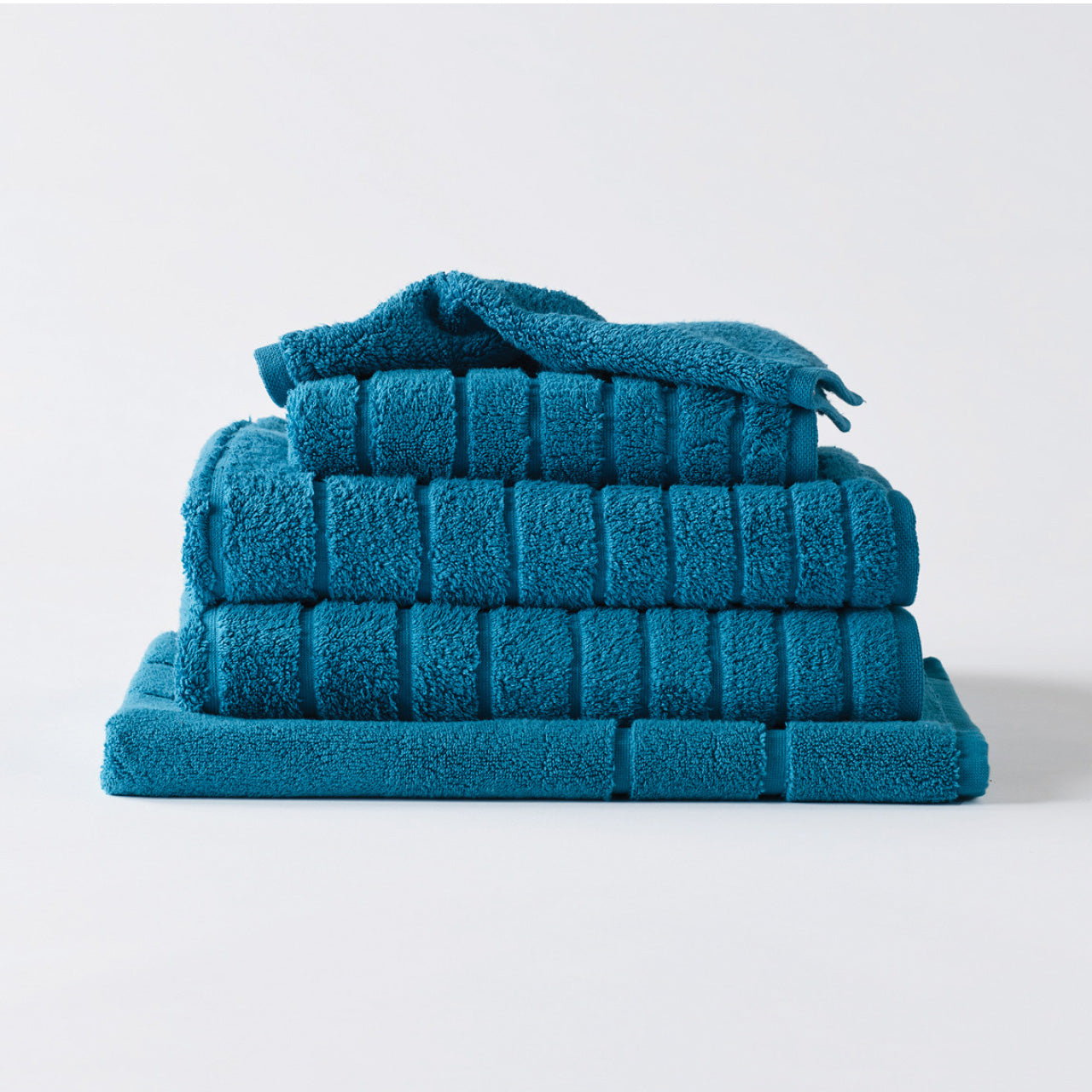 Cooper Towels Peacock Blue on a white background