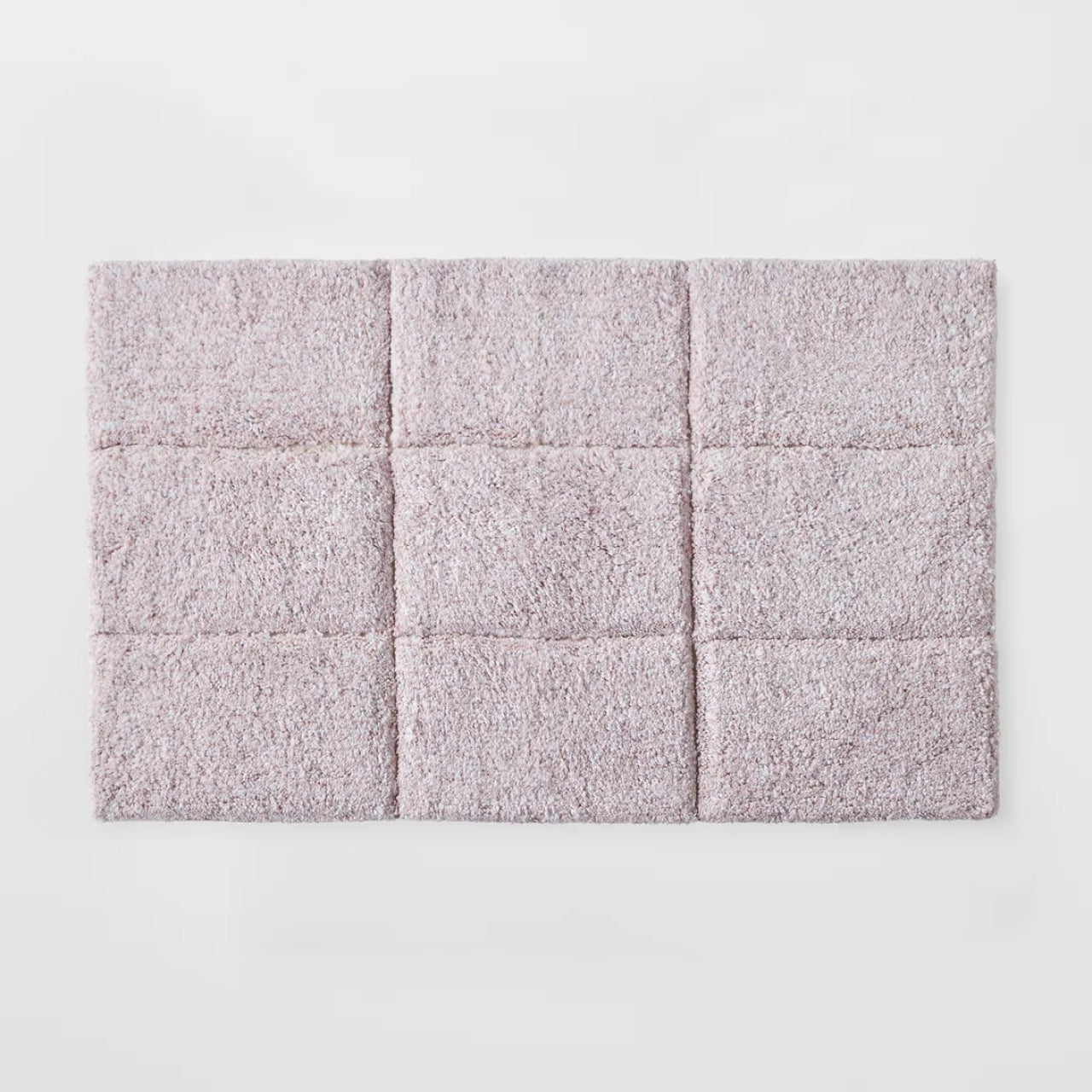 Cooper Tufted Bath Mat Blush on a white background