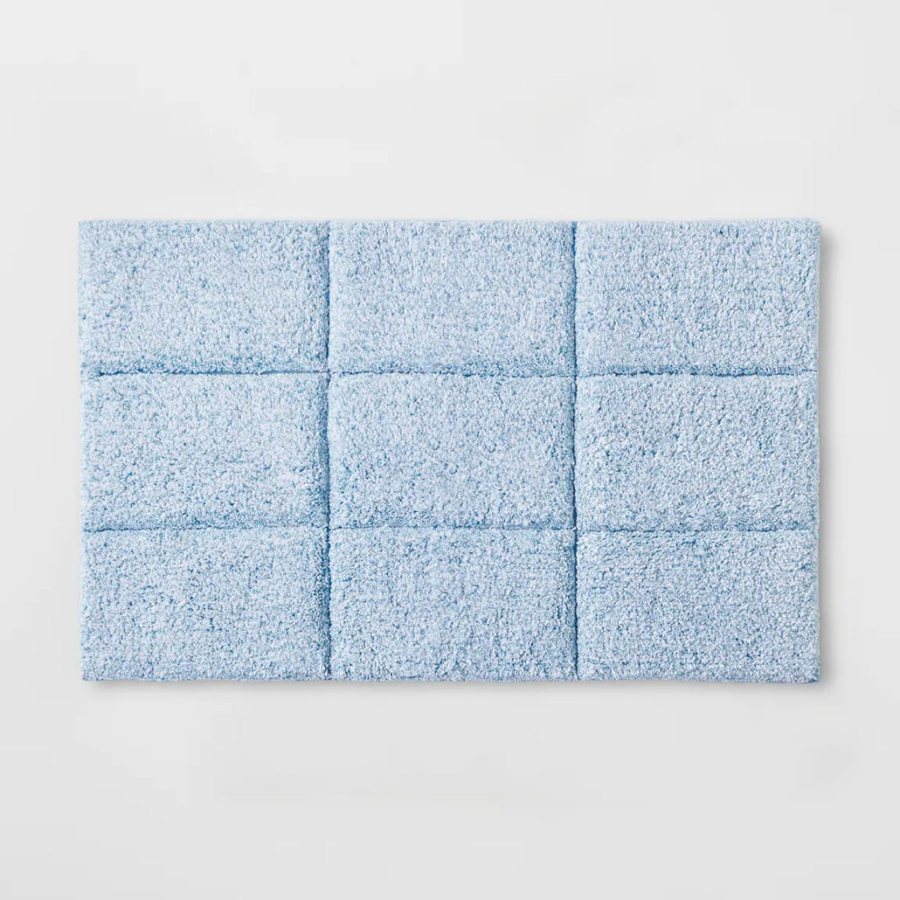 Cooper Tufted Bath Mat Sky Blue on a white background