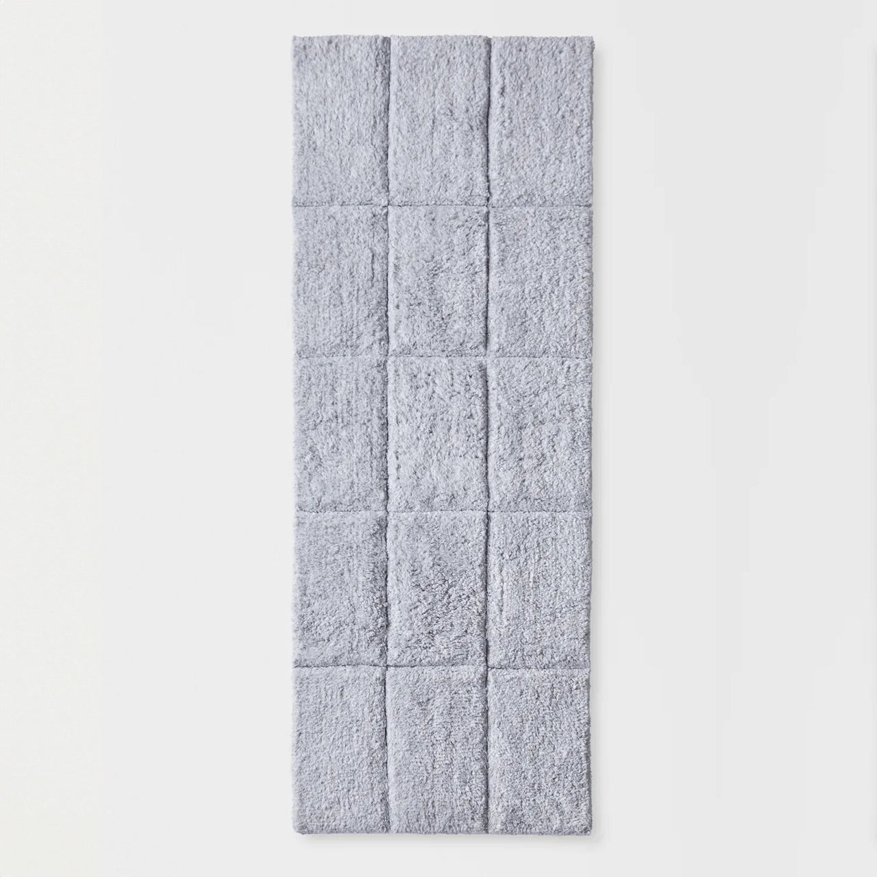 Cooper Tufted Bath Runner Silver on a white background
