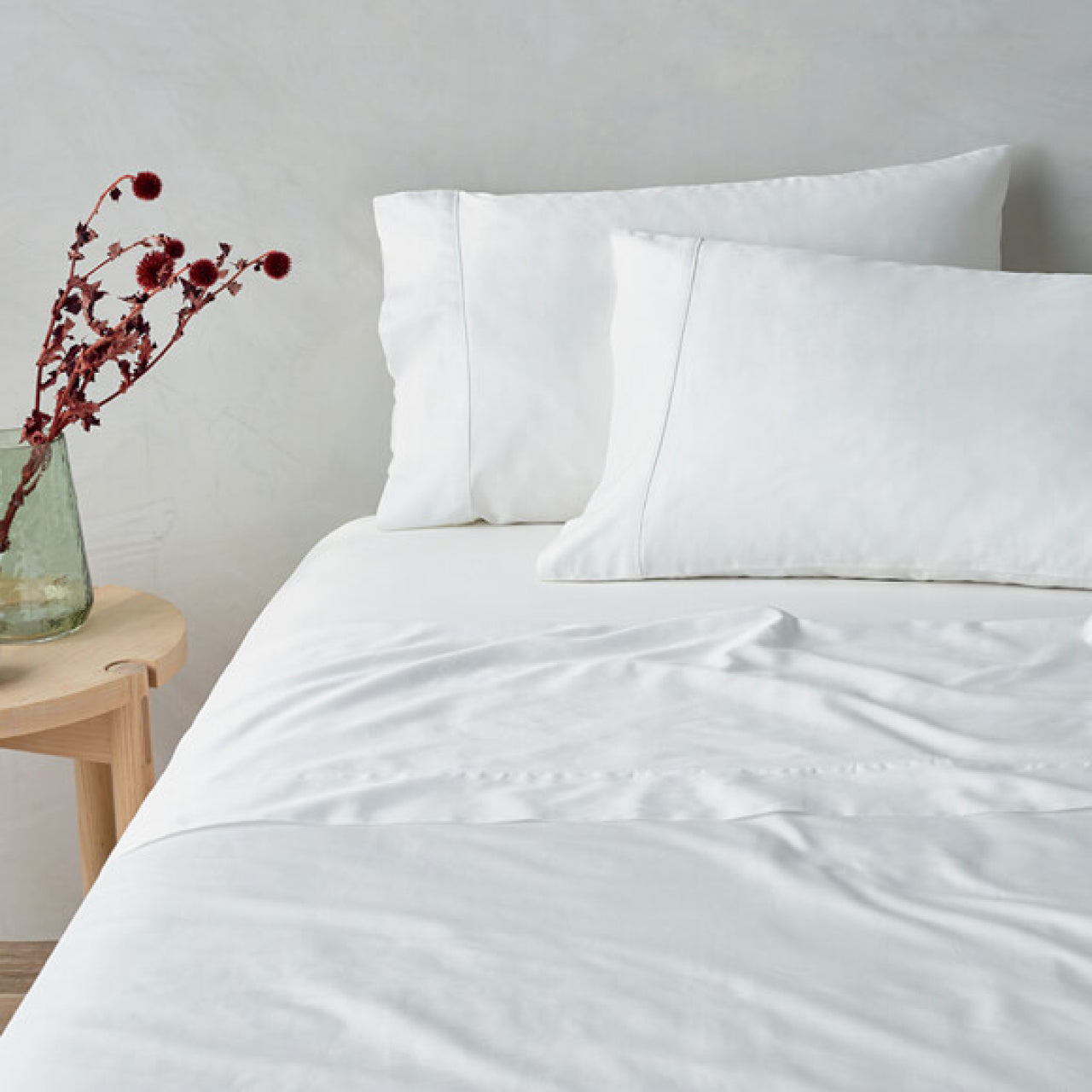 Lifestyle shot of Cotton White Sheets on bed