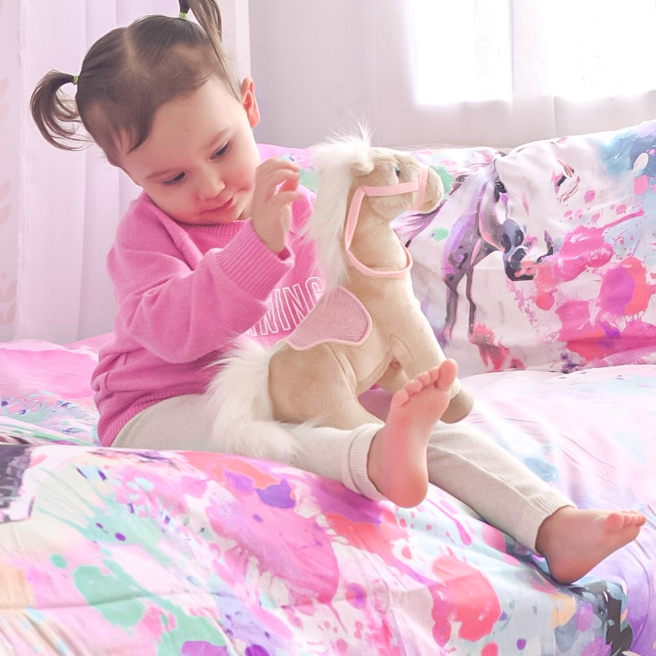 Lifestyle shot of girl playing with Dreamer Soft Toy