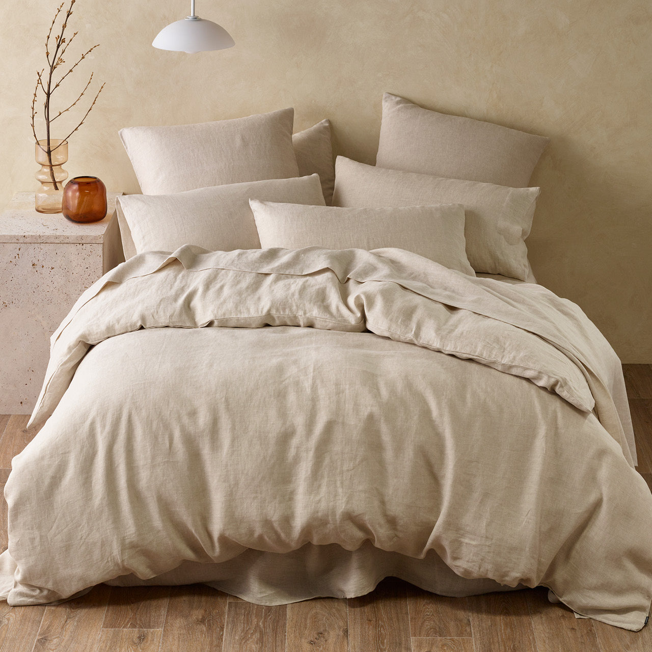 Zoomed out shot of Elayna Quilt Cover Natural on bed