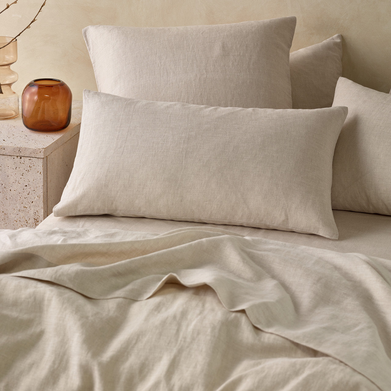 Zoomed in shot of Elayna Natural European Pillowcases on bed