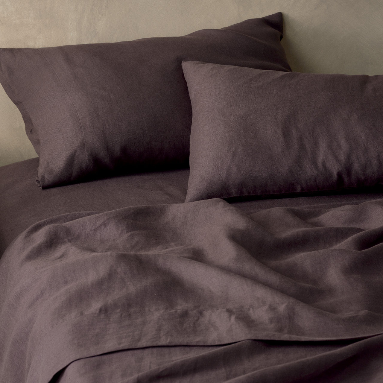 Zoomed in shot of Elayna Espresso Pillowcases on bed