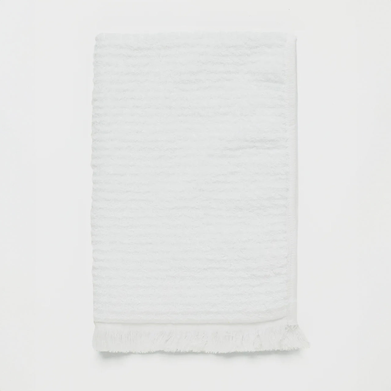 Emine Bath Mat White on a white background