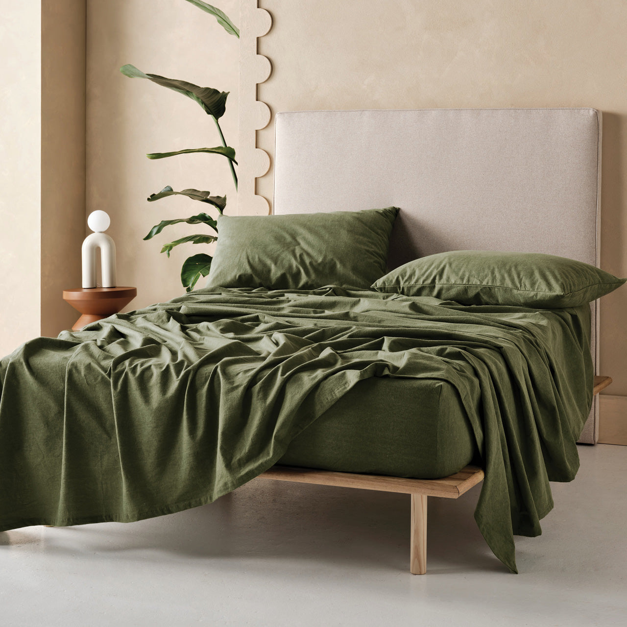 Lifestyle shot of Flannelette Sheet Set Olive on bed
