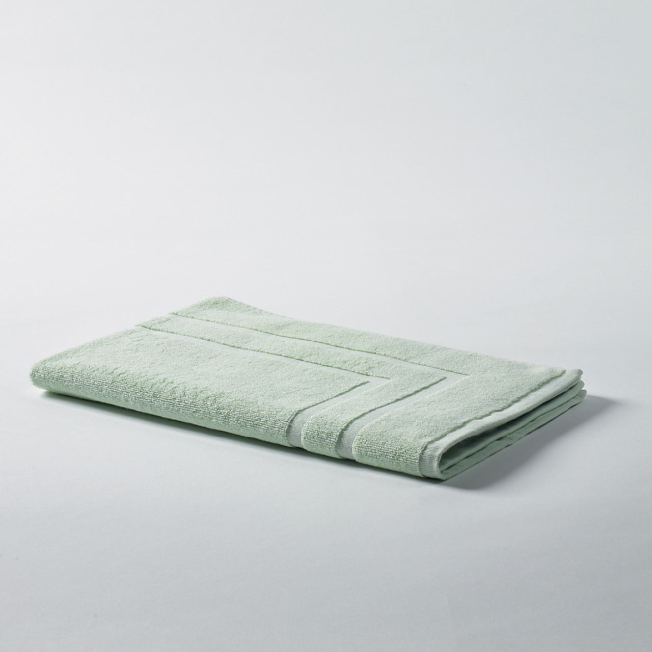 Flint Bath Mat Pistachio on a white background