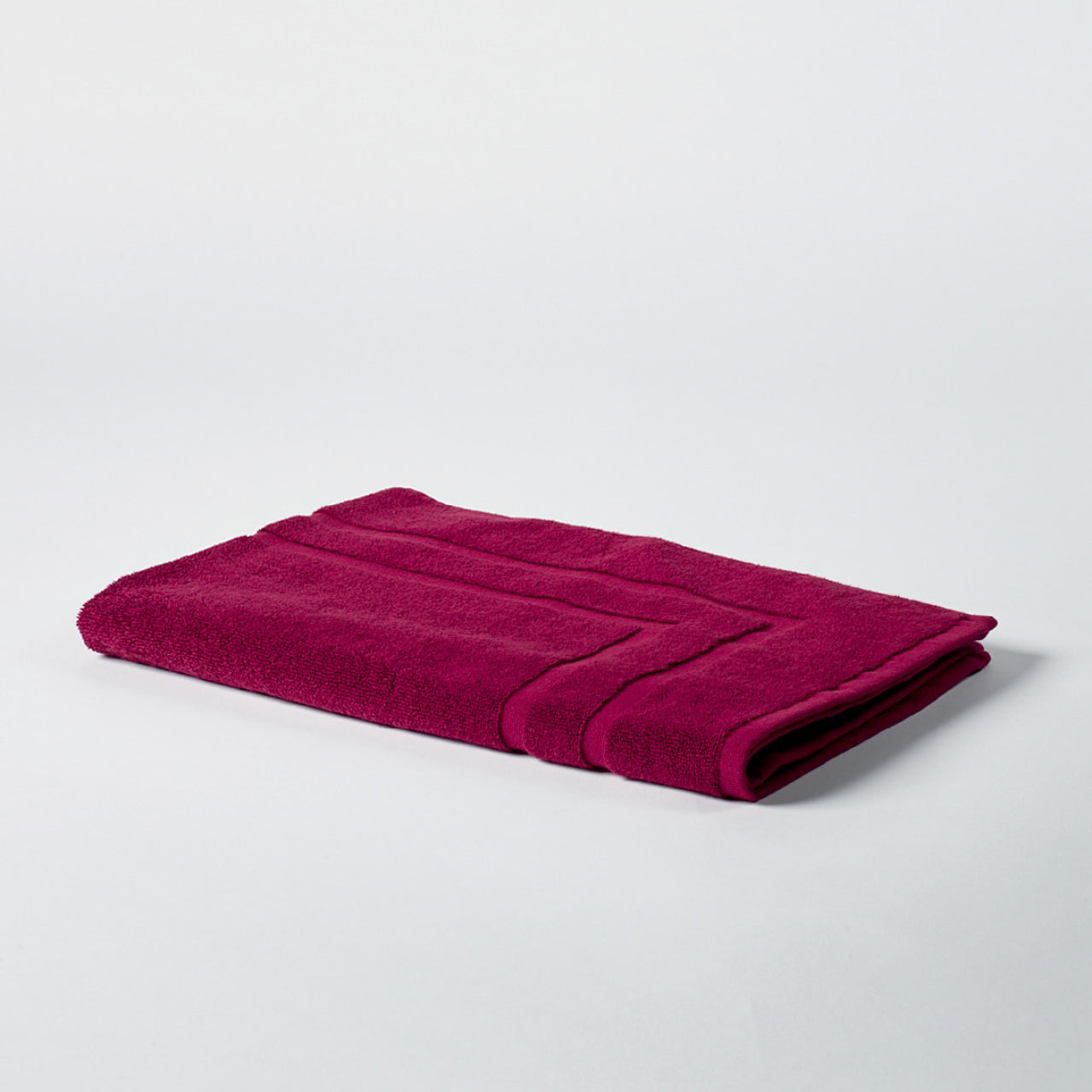 Flint Bath Mat Wine on a white background