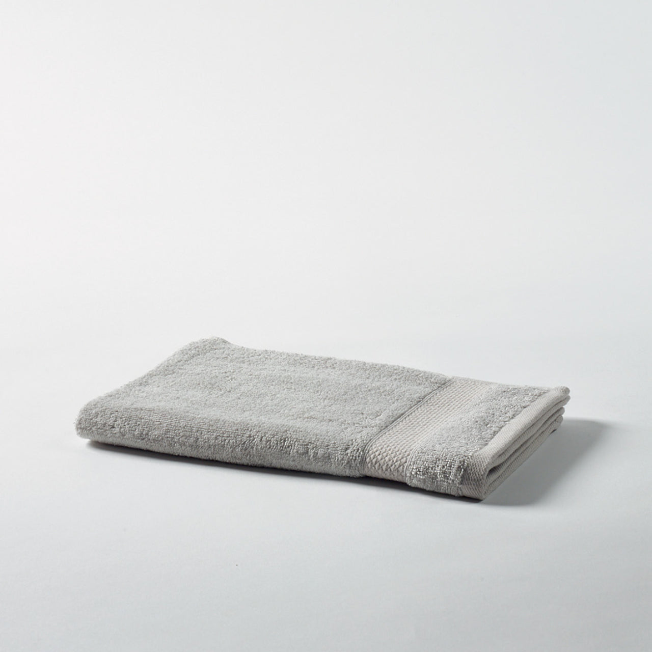 Flint Hand Towel Silver on a white background