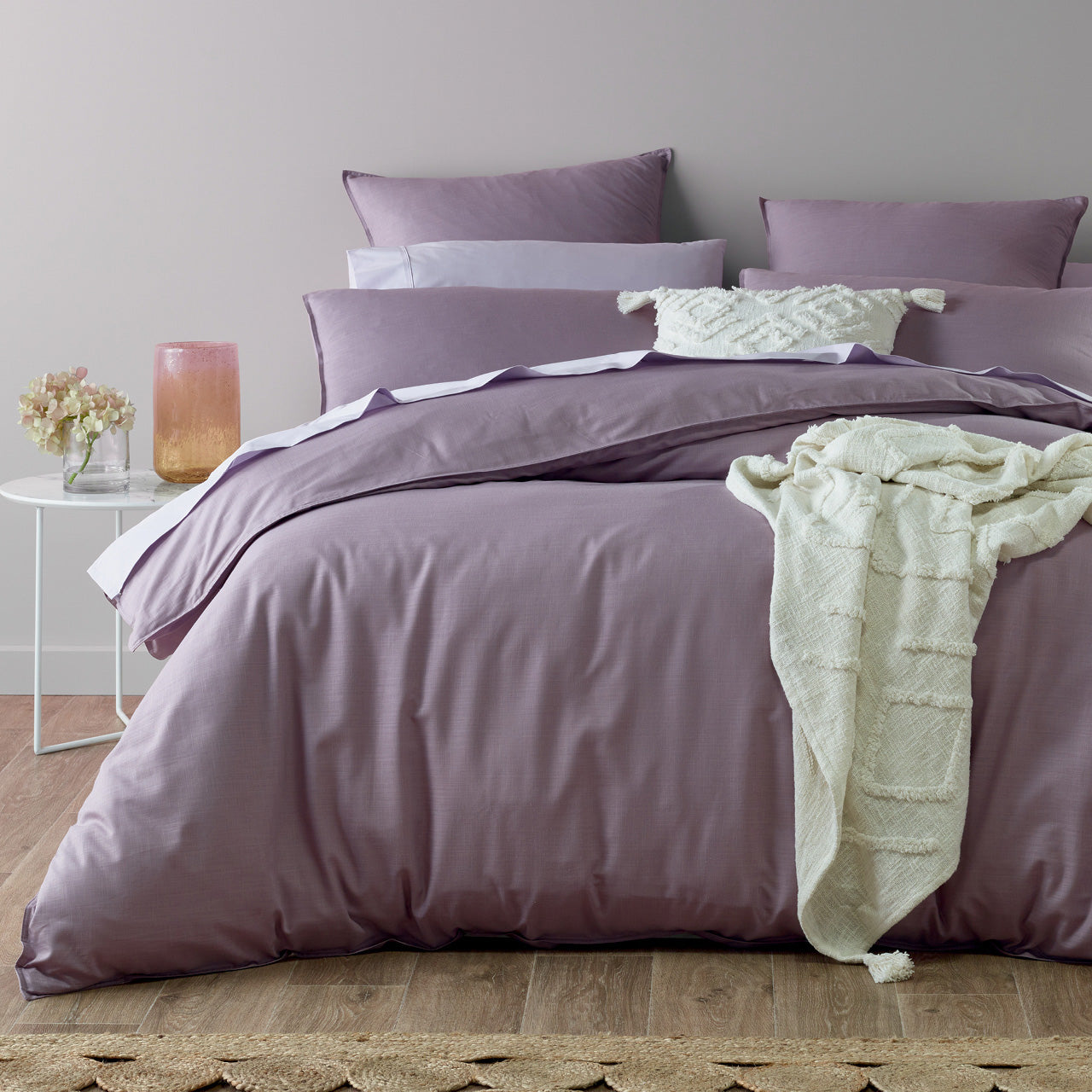 Zoomed out shot of Freya Quilt Cover Set on bed