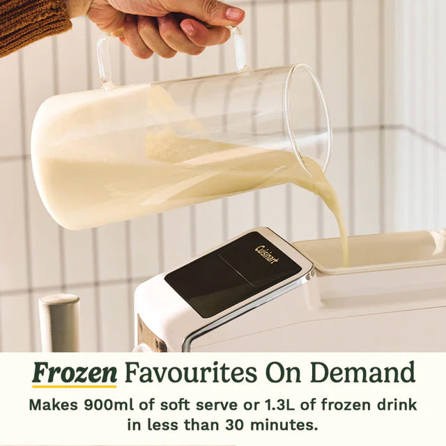 Person pouring a creamy liquid into a machine labeled 'Cuisinart' with text about making frozen drinks.
