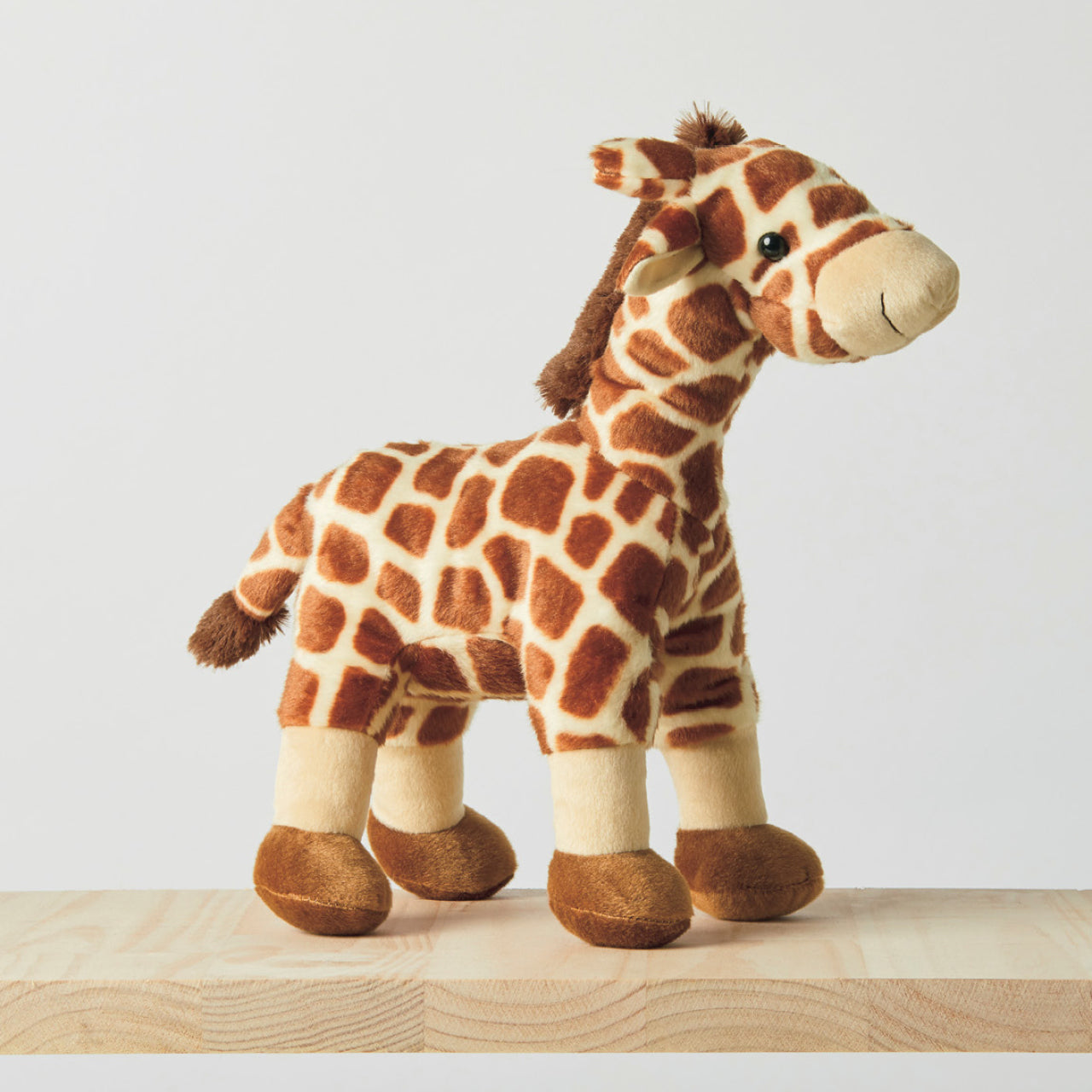 Giraffe Soft Toy standing on ledge