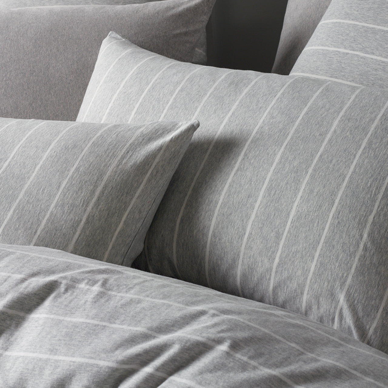 Close up shot of Henley Grey Pillowcases on bed