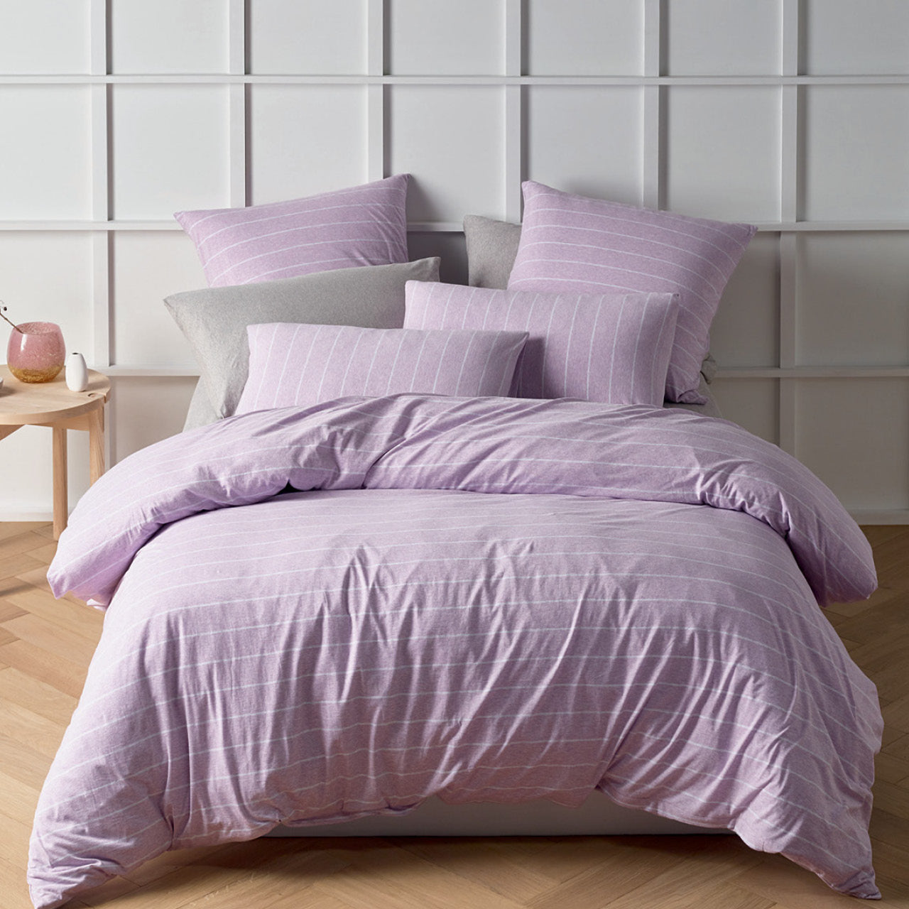 Zoomed out shot of Henley Lilac Quilt Cover Set on bed