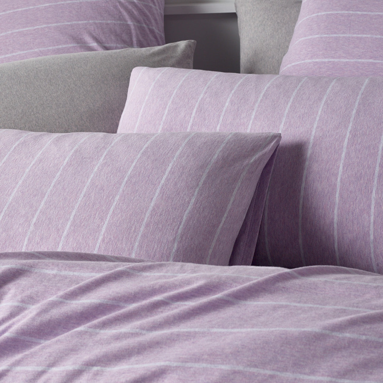 Close up shot of Henley Lilac Pillowcases on bed