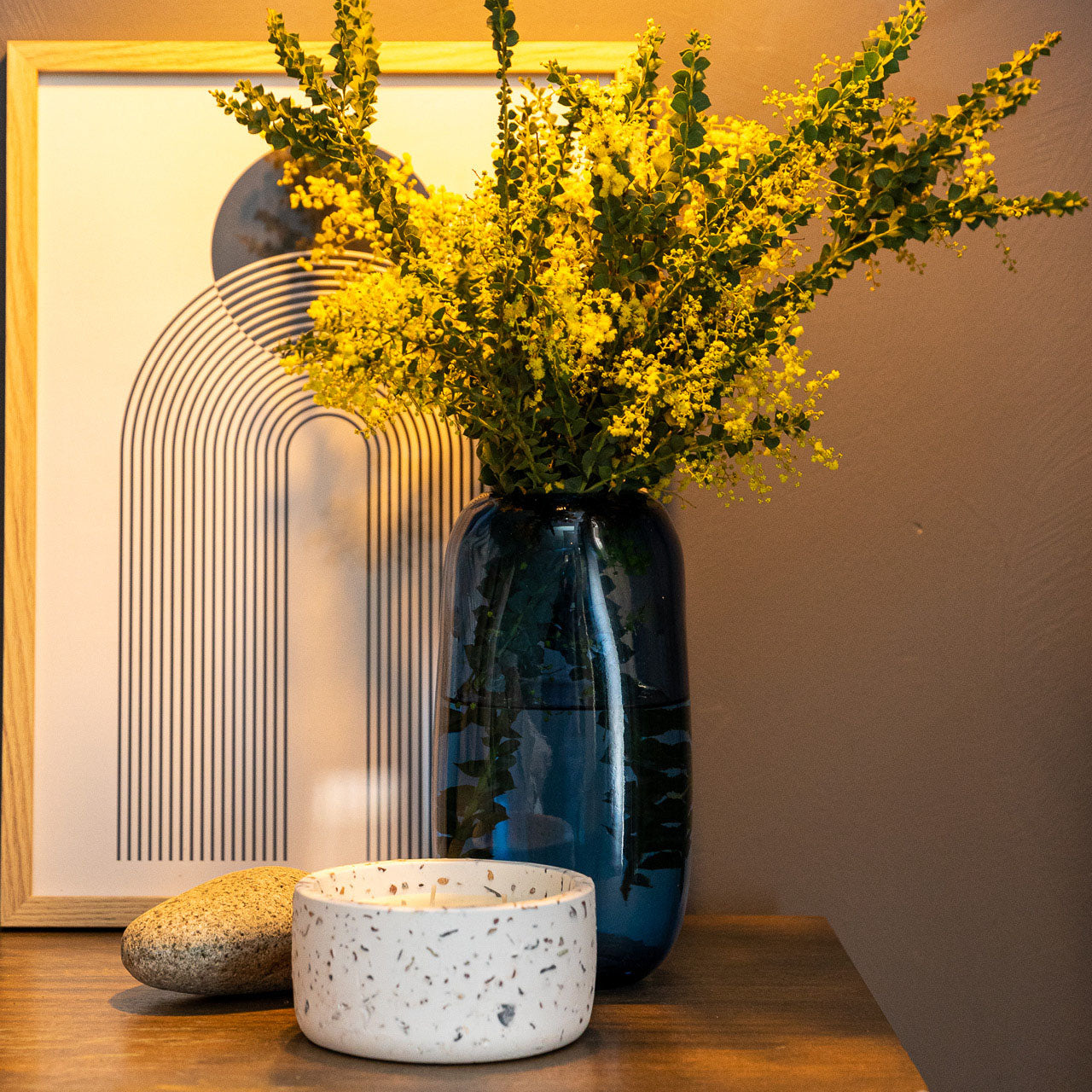 Lifestyle shot of Indiana Vase Indigo with yellow flowers