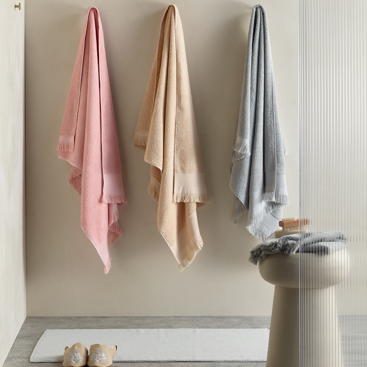 Lifestyle shot of Izmir Towels hanging in bathroom
