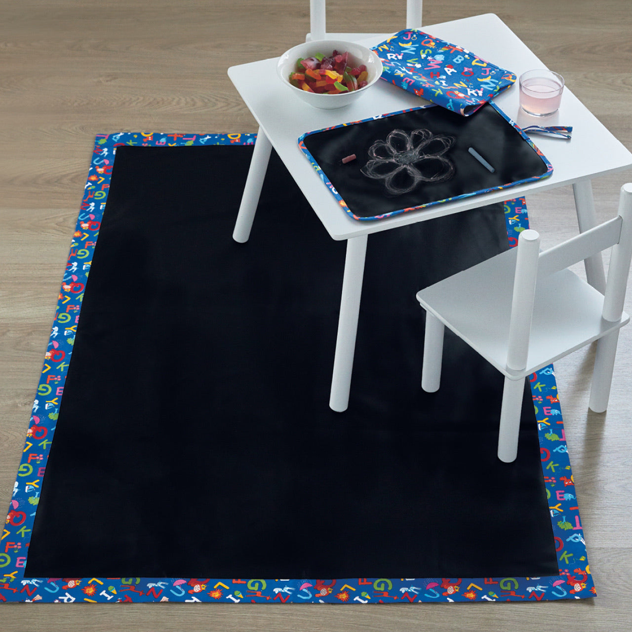 Lifestyle shot of Kids Chalk Placemat underneath play table
