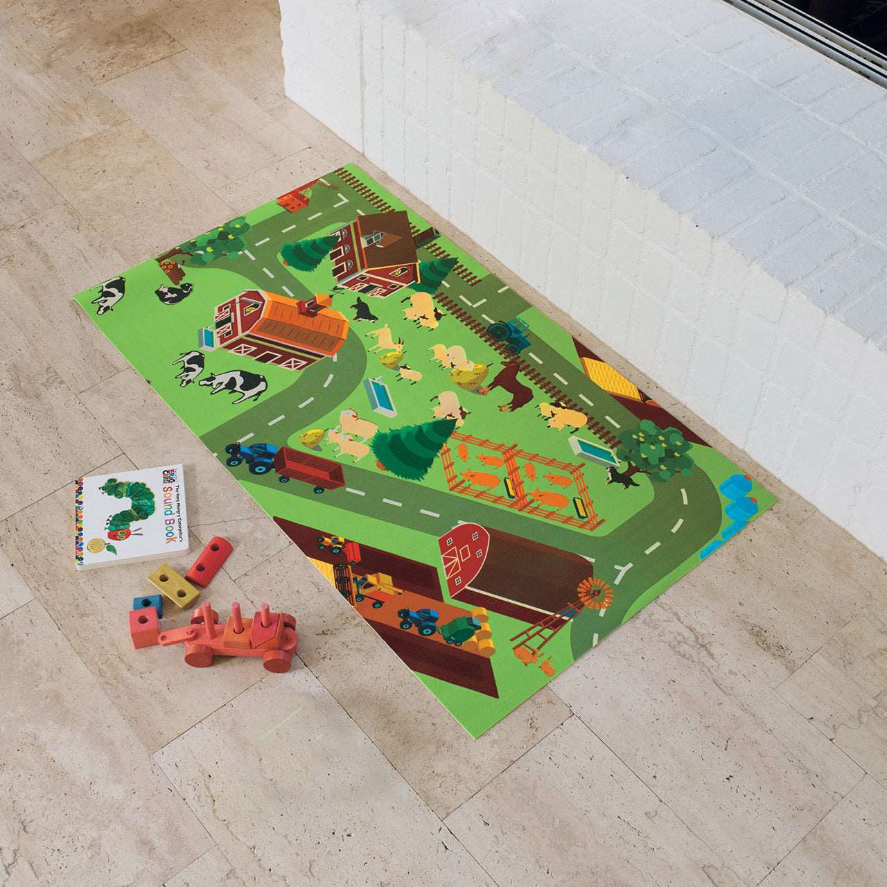 Kids Farm Yard Playmat on floor with toys