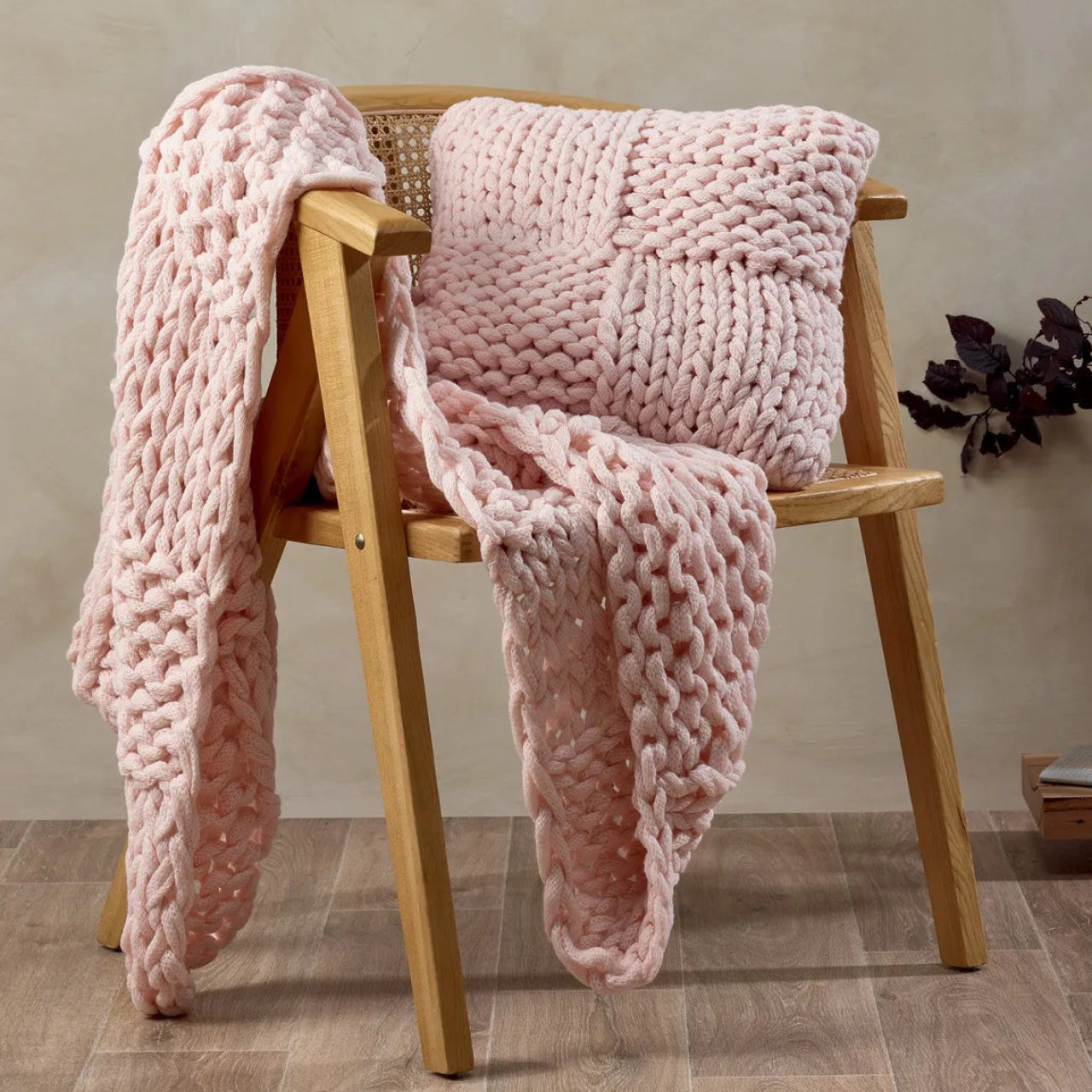Meridian Cushion Cover and Throw Primrose on a chair