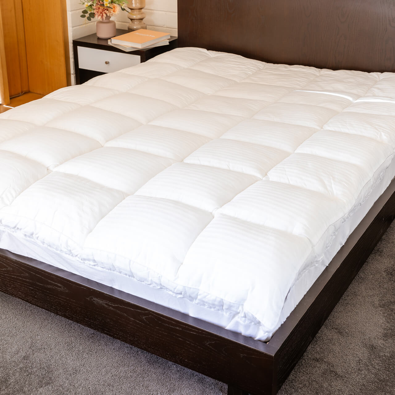 Lifestyle shot of Microfibre Mattress Topper on bed