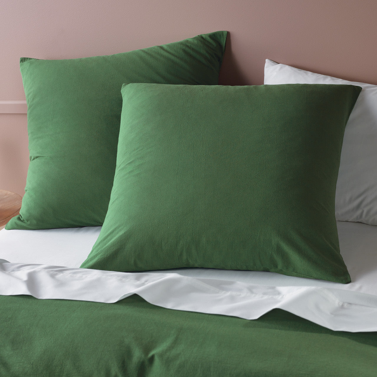 Zoomed in shot of Myrtle European Pillowcases on bed