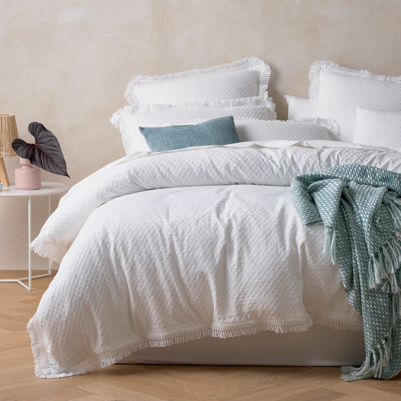 Zoomed out shot of Noosa Quilt Cover Set on bed