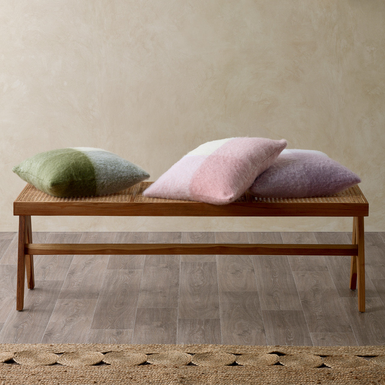Group shot of Penelope Cushion Covers on stool
