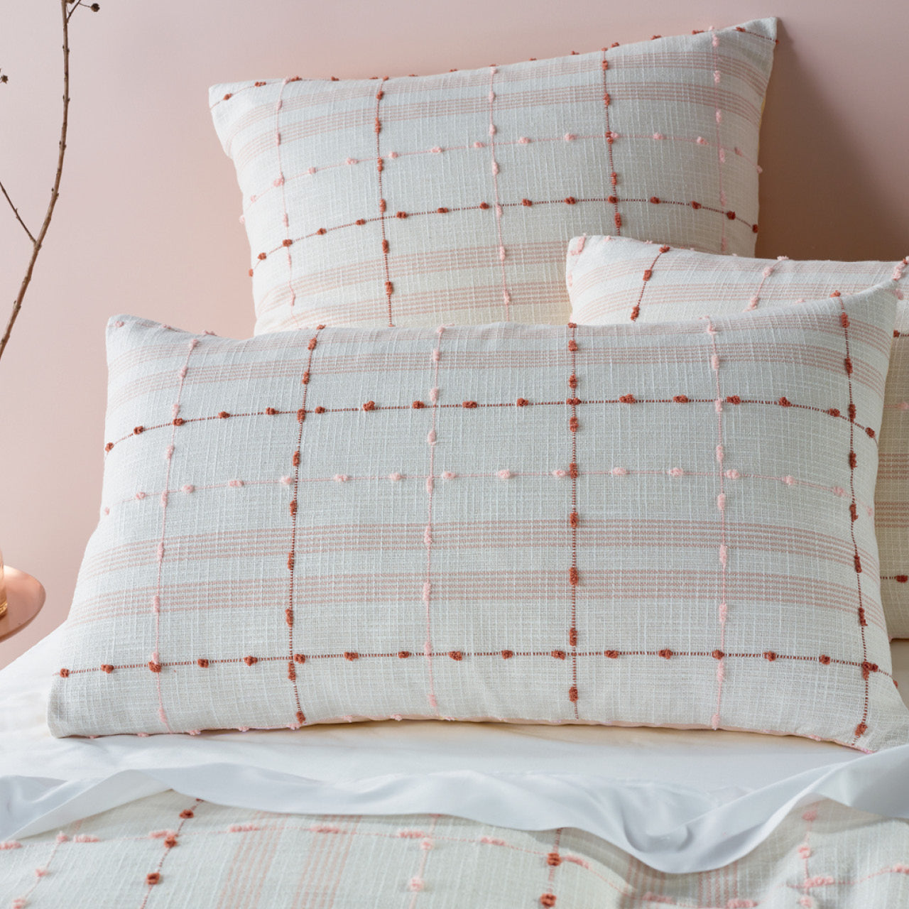 Close up shot of Phoebe Pillowcases on bed